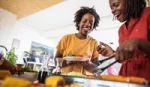 Two women cooking